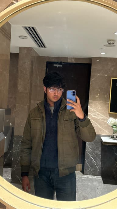 Image of Advik Gupta in front of mirror